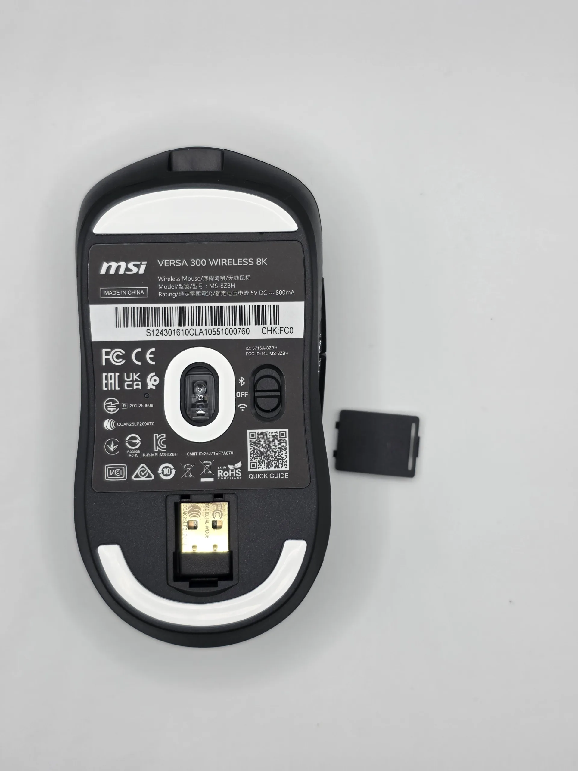 MSI Versa 300 Wireless 8K bottom view showing the PTFE skates and sensor