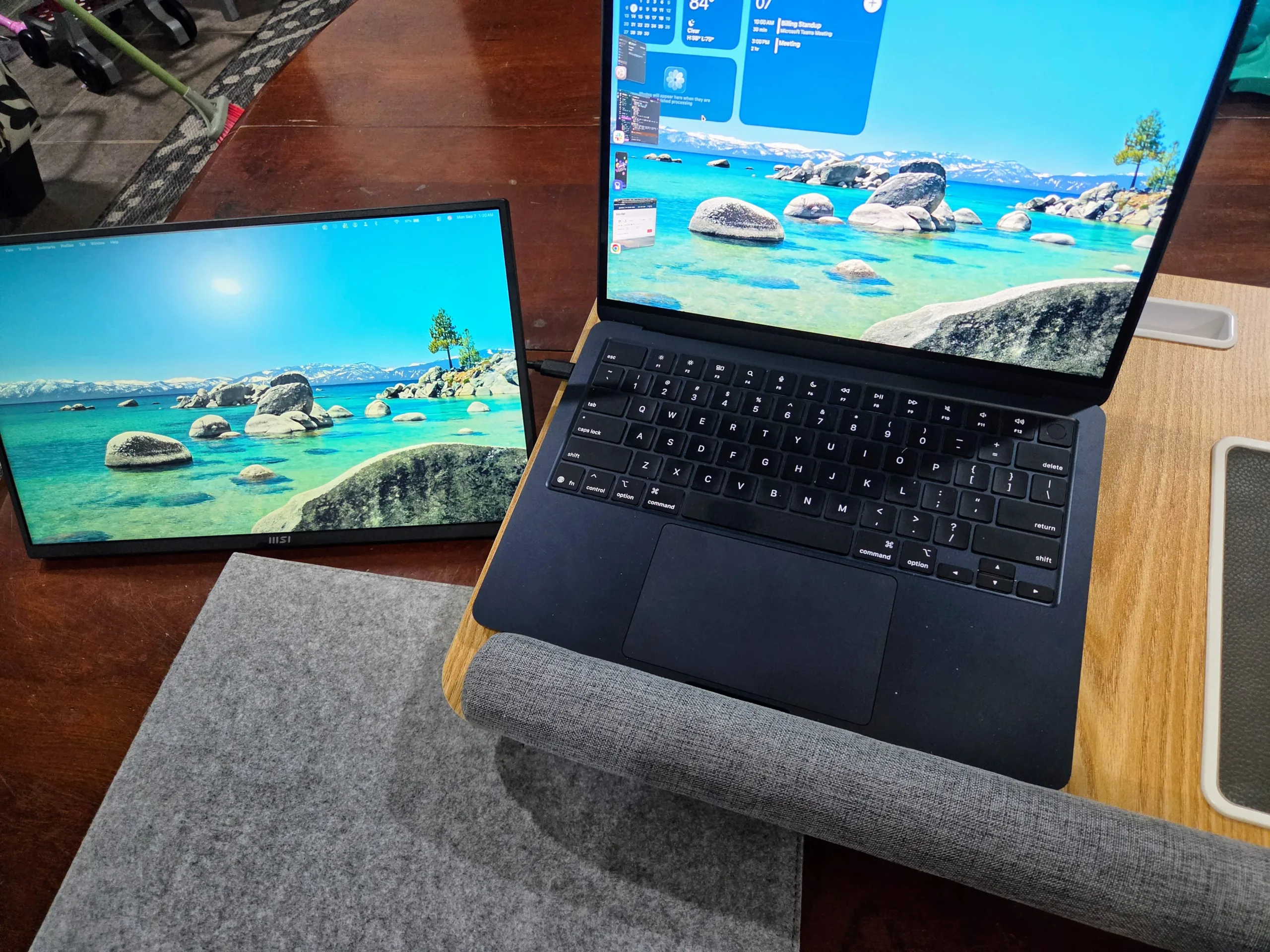 MSI Portable PRO MP165 E6 set up as a secondary display next to a MacBook